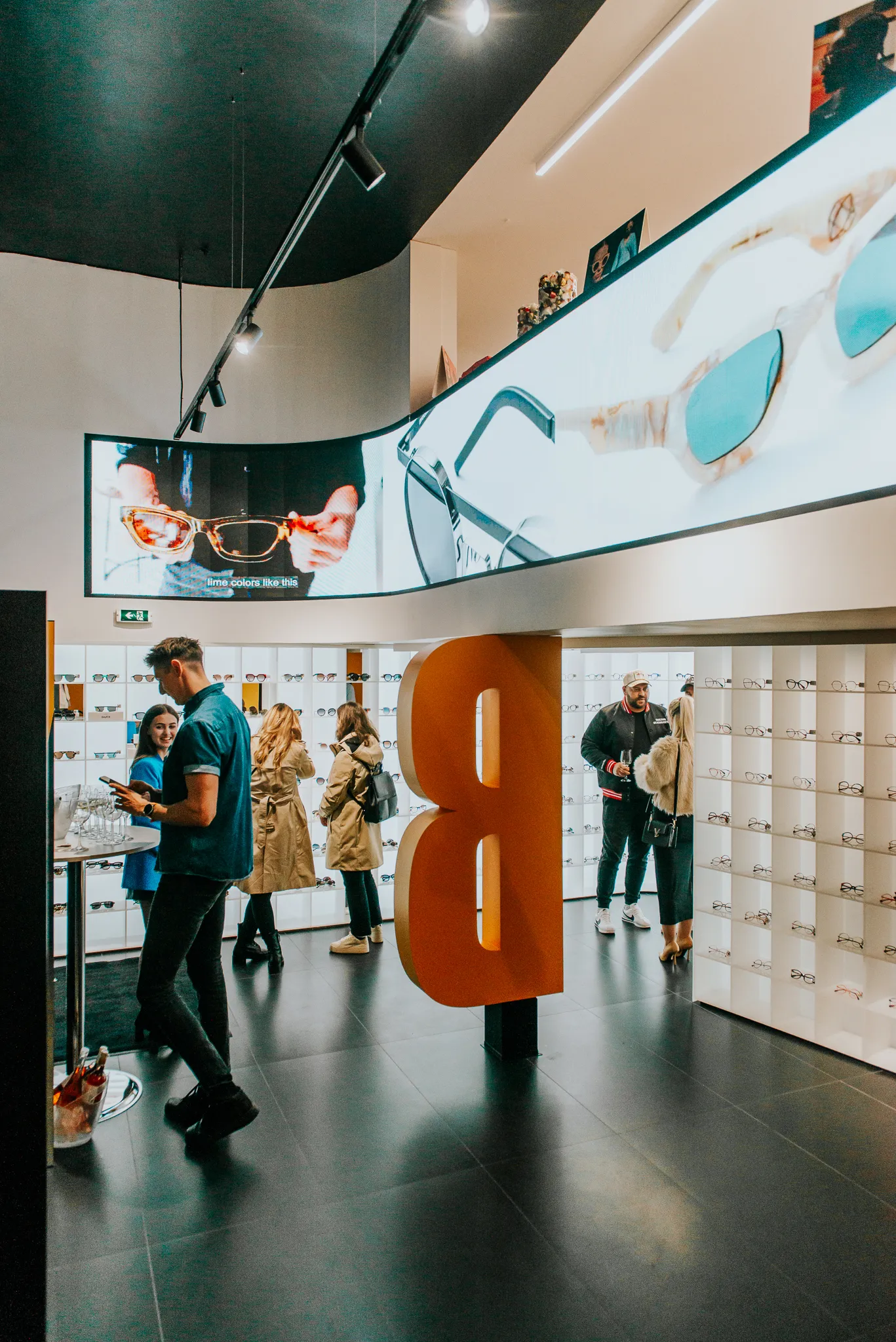 GX Series curved LED display integrated into Blink Optic retail interior in Bucharest
